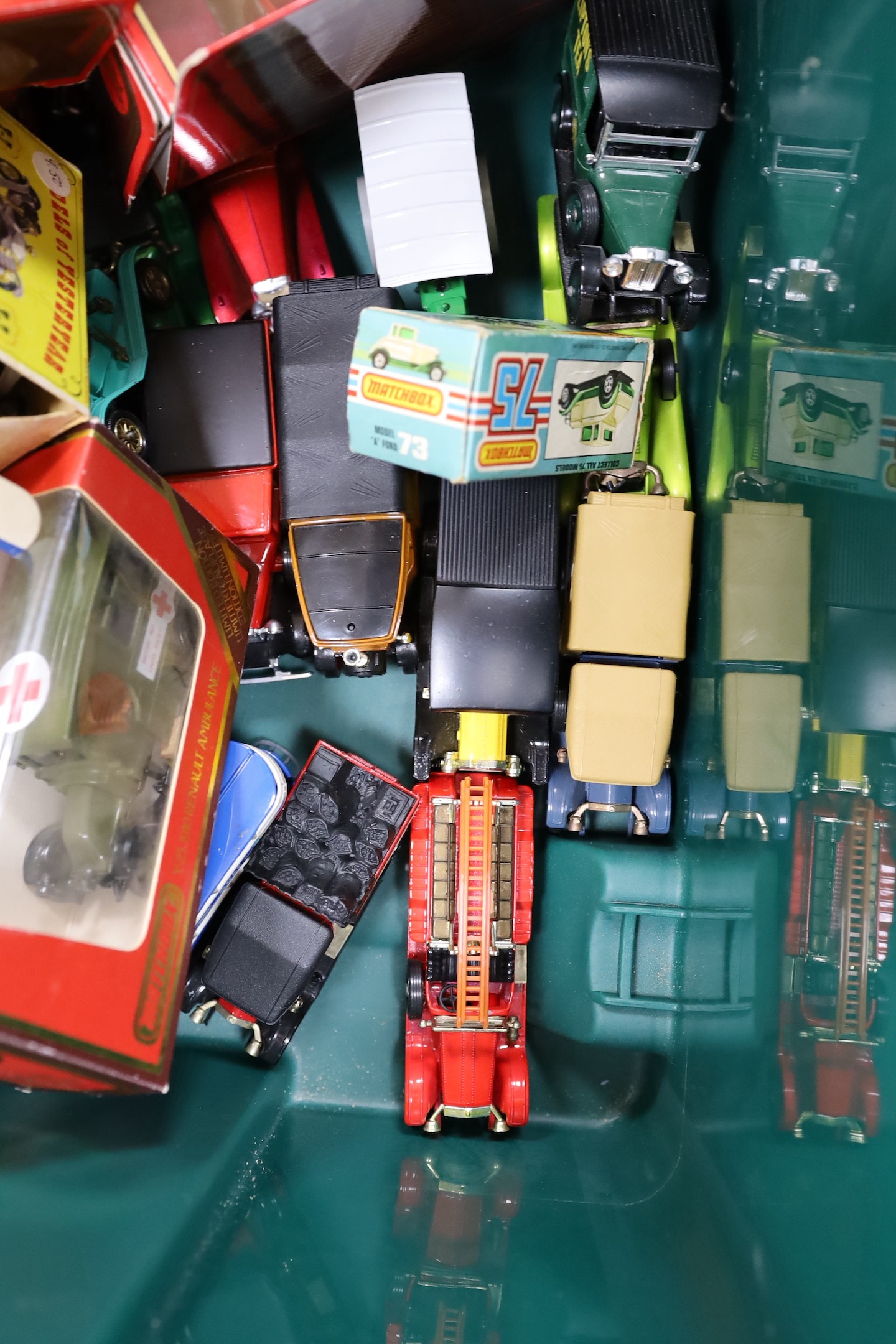 A collection of Matchbox and other die-cast toys